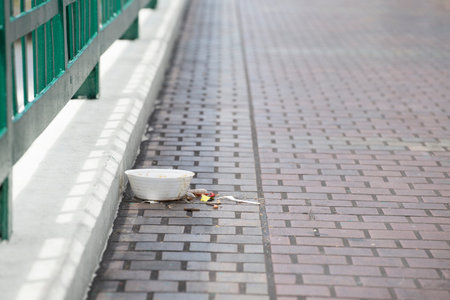 Waste from styrofoam cups on the road
