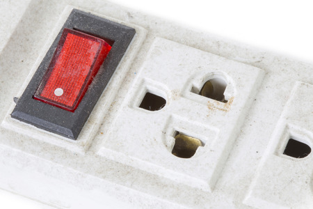 Old plug and red switch on white background isolatedの写真素材