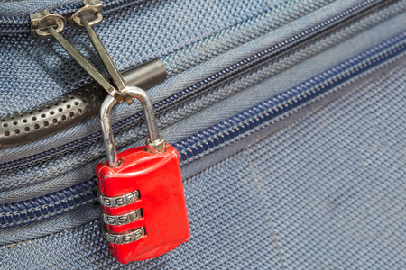 old padlock security 3 combination travel blue suitcase with copyspaceの写真素材