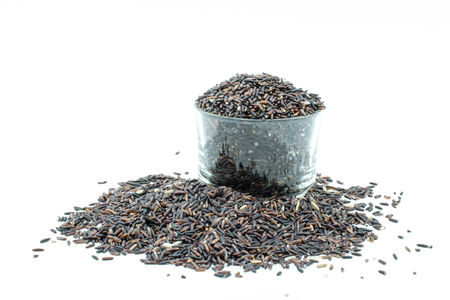 brown rice on white backgroundの写真素材