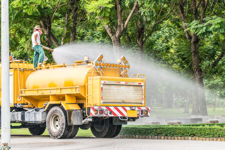 The water truck watering in the parkの写真素材