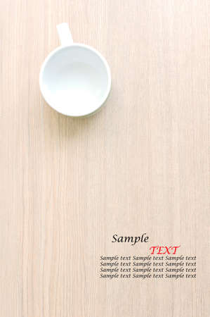 Empty coffee cup on a wooden tableの写真素材