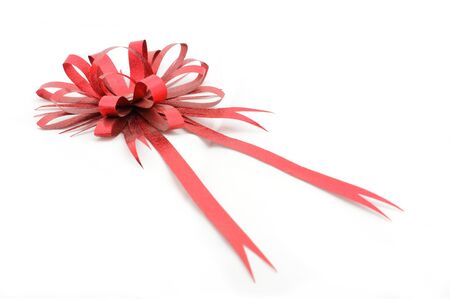 Gift red ribbon and bow isolated on white backgroundの写真素材