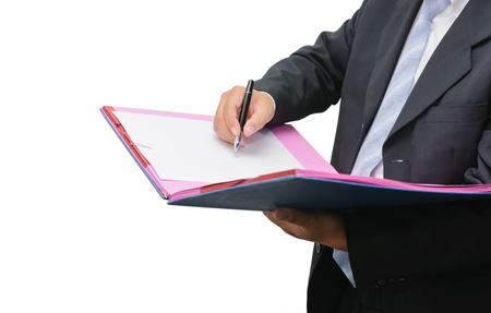 Businessman signing a document on white backgroundの写真素材