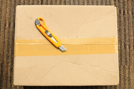 Top veiw of cardboard box closeing tape and cutter with isolated white backgroundの写真素材
