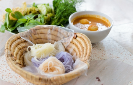 Delicious thai food.KaNom jeen Noodles and curry with vegetable.の写真素材