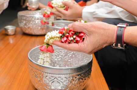 Water black head old people pouring in Songkran festival tradition of thailandの写真素材