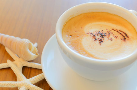 Cappuccino coffe on wooden backgroundの写真素材