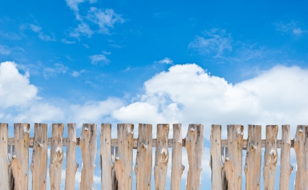 Wooden fence with blue sky backgroundの写真素材