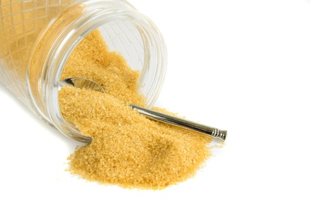 Granulated sugar in jar against a white backgroundの写真素材