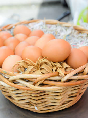 Eggs in wooden basketの写真素材