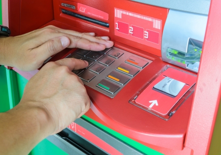 Hand using keypad atm machine の写真素材