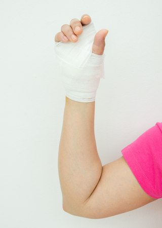 Hand injury with white medicine bandageの写真素材