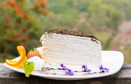 Crepe cake and decor with flowers nature backgroundの写真素材