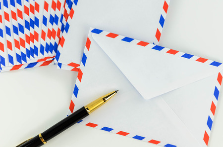 Post Envelope and Pen with White Backgroundの写真素材