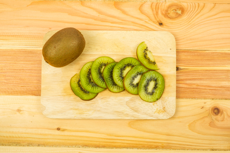 Fresh Kiwi fruit on wooden backgroundの写真素材
