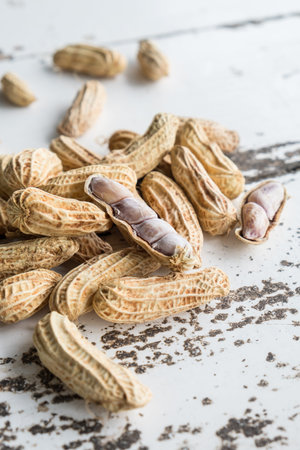 Peanuts on white wooden table
