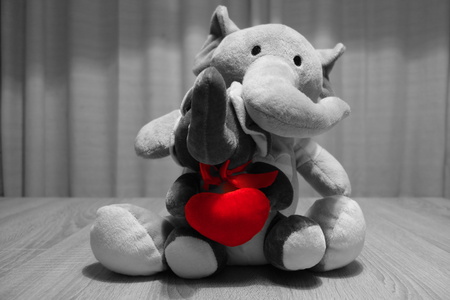 Plush elephants. Toys. Red filter.の写真素材