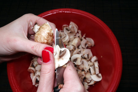 Edible mushrooms slicing, vegan food preparationの写真素材