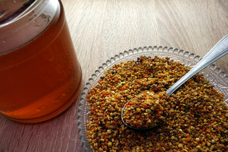 Organic bee pollen and honeyの写真素材