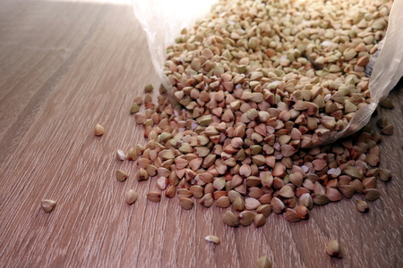 Buckwheat groats on rustic table, healthy organic food conceptの写真素材