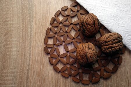 Whole walnuts on rustic wooden tableの写真素材