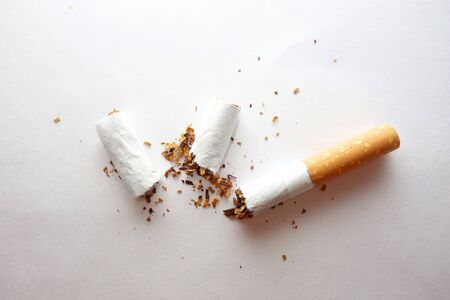 Cracked cigarette, quit smoking conceptの写真素材