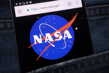 KONSKIE, POLAND - MAY 17, 2018: NASA website displayed on smartphone hidden in jeans pocket