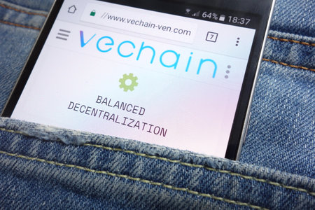 KONSKIE, POLAND - MAY 17, 2018: Vechain-ven website displayed on smartphone hidden in jeans pocketのeditorial素材