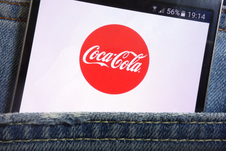 KONSKIE, POLAND - MAY 17, 2018: Coca-cola website displayed on smartphone hidden in jeans pocketのeditorial素材
