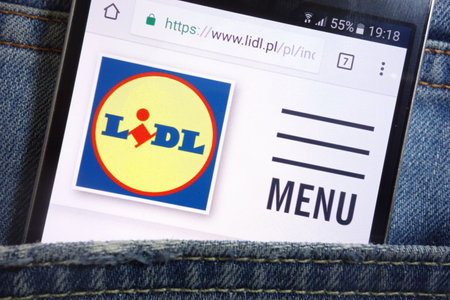 KONSKIE, POLAND - MAY 17, 2018: Lidl website displayed on smartphone hidden in jeans pocketのeditorial素材