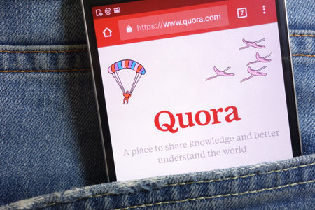 KONSKIE, POLAND - MAY 18, 2018: Quora website displayed on smartphone hidden in jeans pocketのeditorial素材