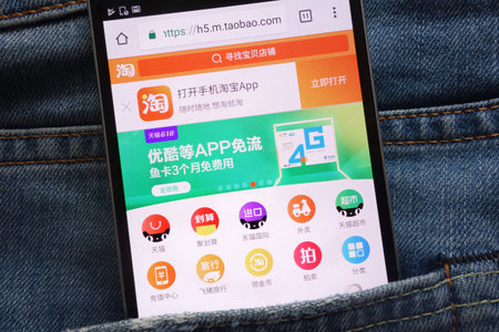 KONSKIE, POLAND - JUNE 02, 2018: Taobao website displayed on smartphone hidden in jeans pocket