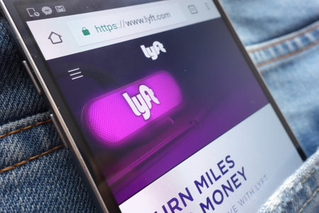 KONSKIE, POLAND - JUNE 02, 2018: Lyft website displayed on smartphone hidden in jeans pocket