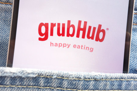 KONSKIE, POLAND - JUNE 02, 2018: Grubhub logo displayed on smartphone hidden in jeans pocket