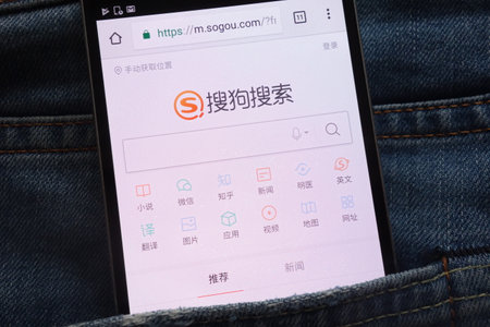 KONSKIE, POLAND - JUNE 02, 2018: Sogou website is displayed on smartphone hidden in jeans pocketのeditorial素材