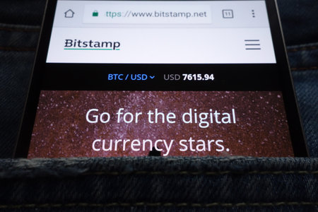 KONSKIE, POLAND - JUNE 02, 2018: Bitstamp cryptocurrency exchange website displayed on smartphone hidden in jeans pocketのeditorial素材