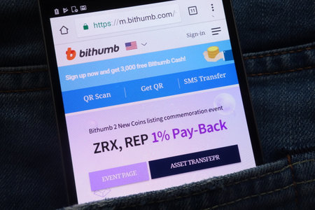 KONSKIE, POLAND - JUNE 02, 2018: Bithumb cryptocurrency exchange website displayed on smartphone hidden in jeans pocketのeditorial素材
