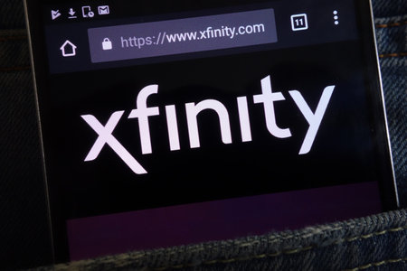 KONSKIE, POLAND - JUNE 02, 2018: Xfinity website displayed on smartphone hidden in jeans pocketのeditorial素材