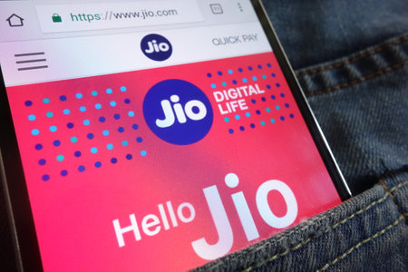 KONSKIE, POLAND - JUNE 02, 2018: Jio website displayed on smartphone hidden in jeans pocketのeditorial素材