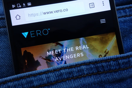 KONSKIE, POLAND - JUNE 11, 2018: Vero website displayed on smartphone hidden in jeans pocketのeditorial素材