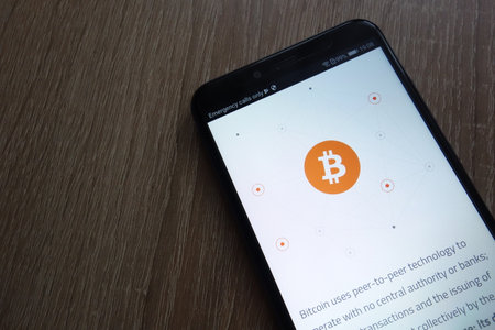 KONSKIE, POLAND - JUNE 30, 2018: Bitcoin cryptocurrency website is displayed on Huawei Y6 2018 smartphoneのeditorial素材