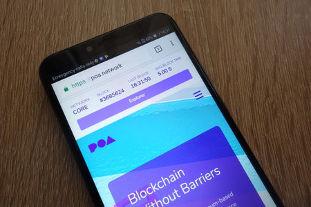 KONSKIE, POLAND - JULY 17, 2018: POA Network cryptocurrency website displayed on a modern smartphoneのeditorial素材