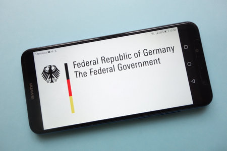 KONSKIE, POLAND - November 12, 2018: The Federal Government of Germany logo displayed on smartphoneのeditorial素材
