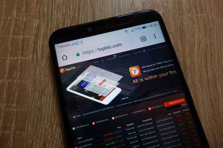 KONSKIE, POLAND - December 16, 2018: TopBtc cryptocurrency exchange website (topbtc.com) displayed on smartphoneのeditorial素材