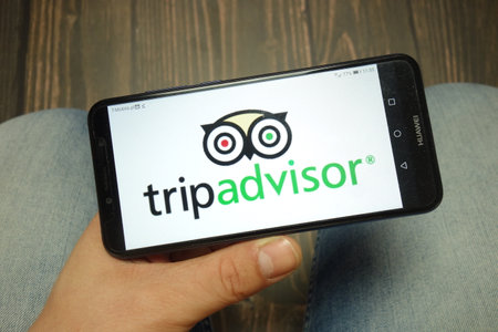 KONSKIE, POLAND - 05 MAY, 2019: TripAdvisor logo displayed on smartphoneのeditorial素材