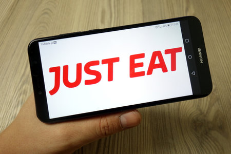 KONSKIE, POLAND - November 19, 2019: Just Eat plc logo displayed on mobile phoneのeditorial素材