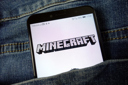 KONSKIE, POLAND - November 24, 2019: Minecraft video game logo displayed on mobile phoneのeditorial素材