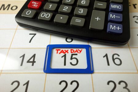 Calendar on office desk showing tax day for filling - April 15 2020, finance conceptの写真素材