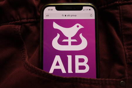 KONSKIE, POLAND - September 15, 2021: Allied Irish Banks plc displayed on mobile phone hidden in jeans pocketのeditorial素材